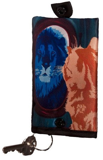 cat looks in mirror and sees his reflection as a lion key chain